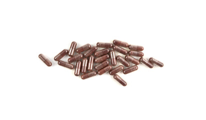 Iron capsule isolated, Fe pills, brown hemoglobin supplement tablets, vitamin capsules on white