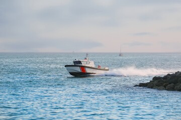 Fototapeta premium Coast guard boat checks coastline
