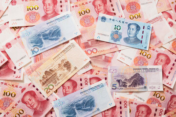 Many of different Chinese yuan banknotes. Chinese paper currency Yuan renminbi banknotes. Money background