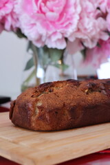 pink rose and cake on a wooden table