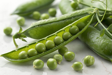 Fresh green peas in a pod healthy raw vegetable perfect for cooking and adding to salads