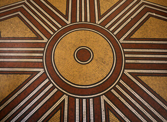 Mosaic floor with multicolored small square tiles with an abstract pattern