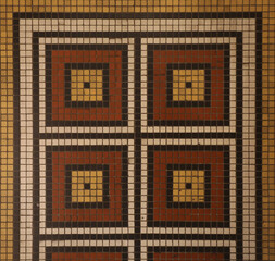 Mosaic floor with multicolored small square tiles with an abstract pattern