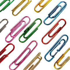 Colorful paper clips arranged diagonally on a black background