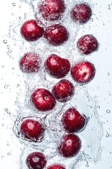 floating cherry fruits with water splash, isolated on white background