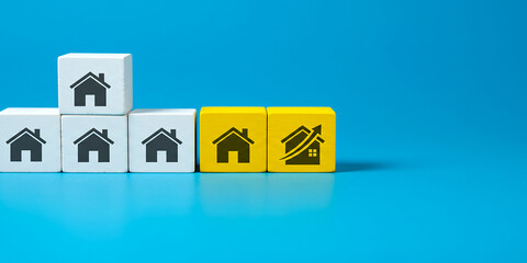 Multiple home icons with single yellow highlighted box showing property selection choice or real estate deal
