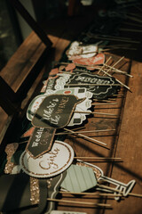 Wedding Photo Booth Props on Wooden Table with Fun Sayings