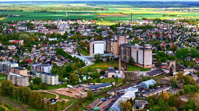 Aerial view of Joni&scaron;kis featuring agricultural fields, industry, and housing