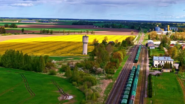 Aerial view of Joni&scaron;kis with beautiful landscape of fields, railway, and water tower