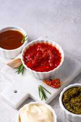 Set of different sauces. Ketchup, mustard, pesto