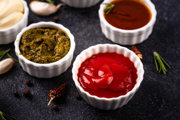 Set of different sauces. Ketchup, mustard, pesto