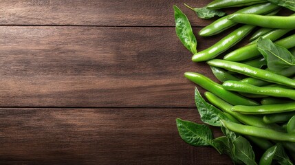 A vibrant display of fresh green beans lies on a rustic wooden table, emphasizing natural produce and wholesome living, perfect for culinary, health, or organic themes in imagery.