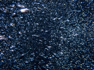 Bubbles underwater rising to water surface, natural scene bubble under water, Mediterranean sea