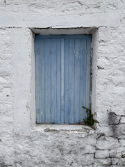 Blue Wooden Shutters on White Wall