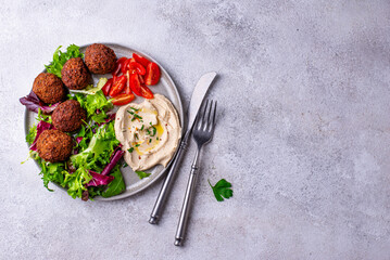 Salad with hummus, falafel and vegetables