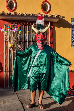 Man dancing in a traditional costume, Carnival Parade at the Xolotl Street, Oaxaca de Juarez, Oaxaca State, Mexico