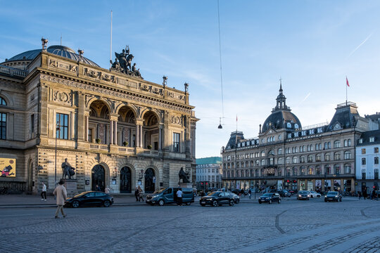View of Kongens Nytorv (The King's New Square) with Det Kongelige Teater (The Royal Theatre) on the left and Magasin du Nord on the right, framing this iconic civic space.