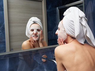 Woman put face mask at bathroom