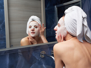 Woman put face mask at bathroom