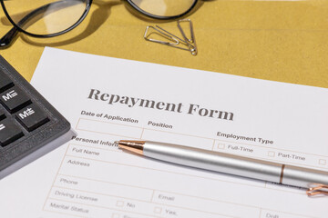 Financial Repayment Document on Tabletop – Structured Payment Agreement in Business Setting