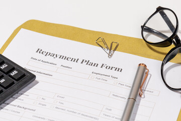 Financial Planning Setup – Repayment Plan Form Ready for Signature with Pen on Desk