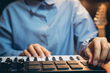 Pianist concept. Person Playing Keyboard Musical Instrument in a Stylish Studio Environment with Soft Lighting and Focused Expression