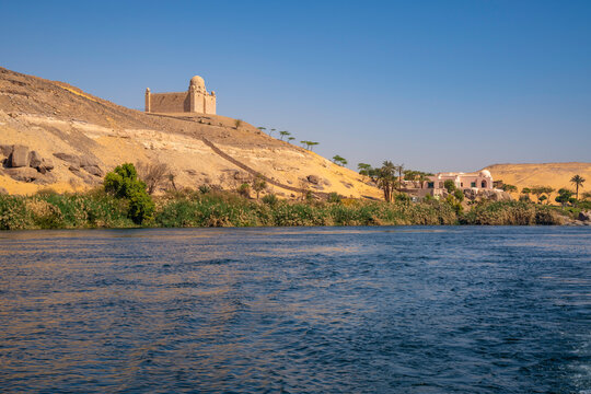 View of the Nile river and Aga Khan Mausoleum from small boat in Aswan, Aswan, Nubia, Egypt, North Africa, Africa