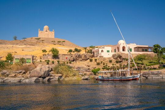 View of the Nile river and Aga Khan Mausoleum from small boat in Aswan, Aswan, Nubia, Egypt, North Africa, Africa