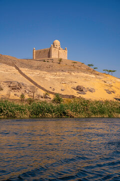 View of the Nile river and Aga Khan Mausoleum from small boat in Aswan, Aswan, Nubia, Egypt, North Africa, Africa