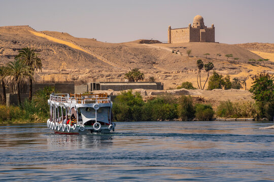 View of the Nile river and Aga Khan Mausoleum from small boat in Aswan, Aswan, Nubia, Egypt, North Africa, Africa