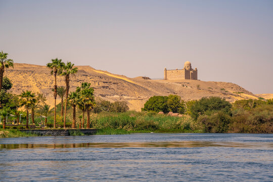 View of the Nile river and Aga Khan Mausoleum from small boat in Aswan, Aswan, Nubia, Egypt, North Africa, Africa