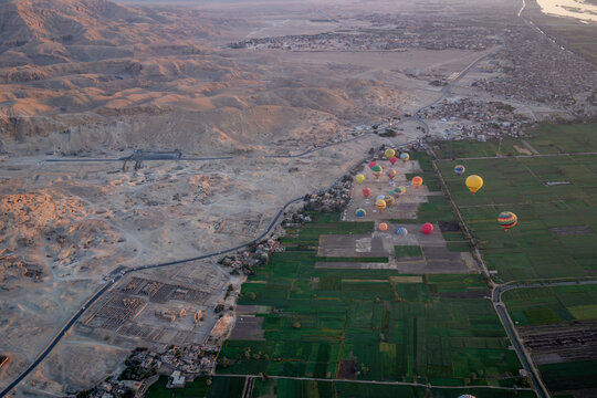 View of other balloons from hot air balloon over Luxor at sunrise, Luxor, Egypt, Africa