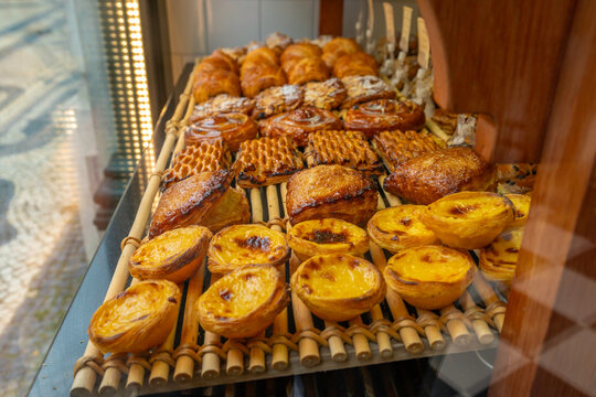 View of Pastel de Nata custard tarts in shop window in Lisbon city centre, Lisbon, Portugal, Europe