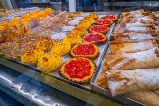 View of various tarts in shop window in Lisbon city centre, Lisbon, Portugal, Europe