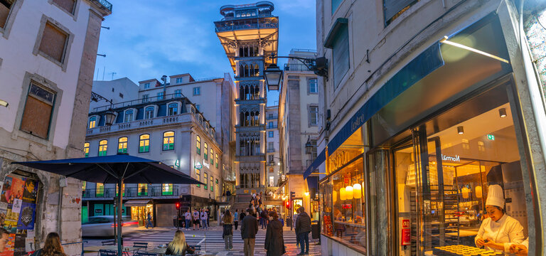View of Santa Justa Lift and shops at dusk, Lisbon, Portugal, Europe