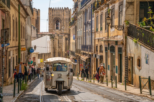 View of Tuk Tuk and Lisbon Cathedral in Alfama, Alfama District, Lisbon, Portugal, Europe