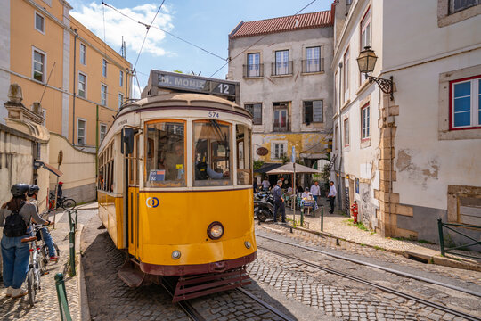 View of colourful architectecture and vintage tram in Alfama, Alfama District, Lisbon, Portugal, Europe