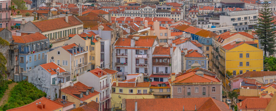 View of rooftops and colourful buildings from Miradouro da Senhora do Monte scenic point on a sunny day in the Alfama District, Lisbon, Portugal, Europe