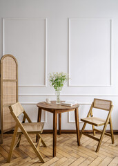 Bright boho living room with elegant wooden furniture and cozy decor elements