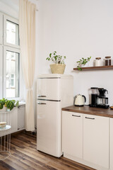 Cozy boho living room featuring modern kitchen and charming decor details