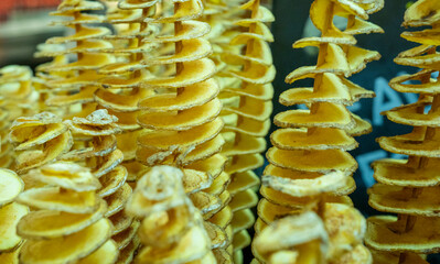 Colorful spiral potato snacks at Mercat de la Boqueria in Barcelona