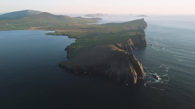 Picturesque 4K Aerial video of flying above scenic Dingle Peninsula Atlantic coast at sunset, Kerry, Ireland