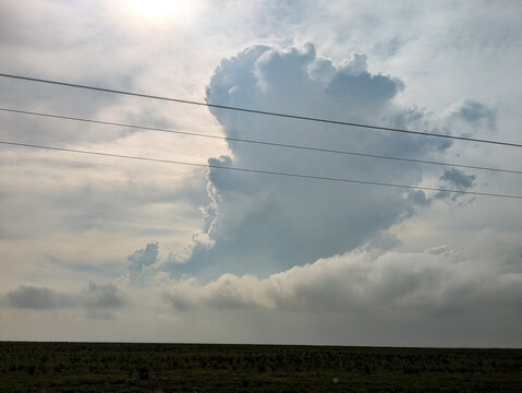 A thunderstorm updraft forms over the Great Plains.