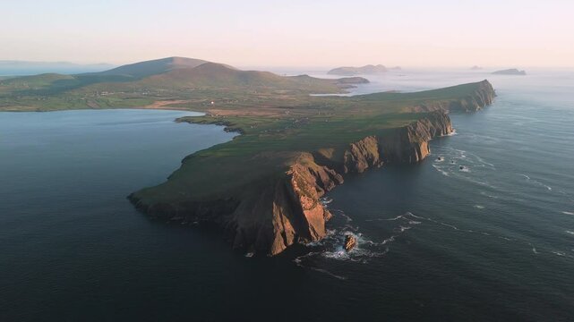 Picturesque 4K Aerial video of flying above scenic Dingle Peninsula Atlantic coast at sunset, Kerry, Ireland