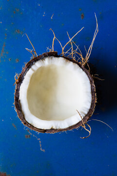 Half of a coconut on metal surface 