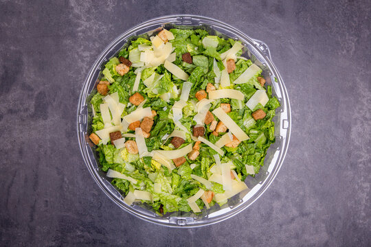 Salad on a plastic catering container 