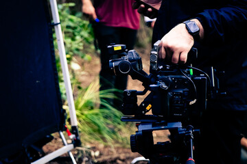 Setting up a camera on top of a tripod to keep it stable so that it can shoot smooth footage even on a moving car.