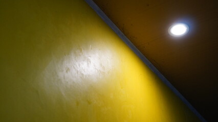 Intriguing Interior Corner with Yellow Wall and Dark Ceiling