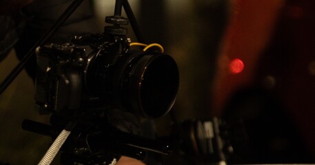 Setting up a camera on top of a tripod to keep it stable so that it can shoot smooth footage even on a moving car.