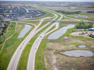 Highway with a lot of cars on it and a lot of grass